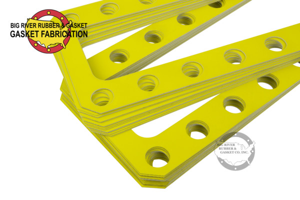 Thin yellow aluminum shim gasket rectangle shape with round bolt holes