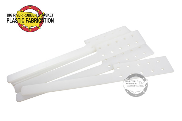White hard plastic paddles with holes
